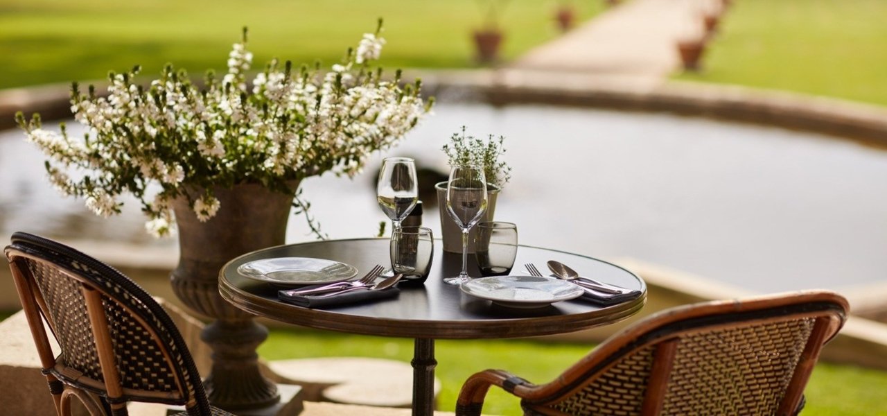 Outdoor table at Domaine de Fontenille - Wine Paths